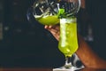 Barman pooring cocktail. Cocktail being prepared. Royalty Free Stock Photo