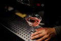 Barman pouring campari liquor into the cocktail Royalty Free Stock Photo