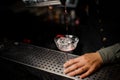 Barman pouring a cocktail with campari into a glass Royalty Free Stock Photo