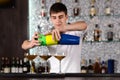 Barman pouring cocktails at the bar counter Royalty Free Stock Photo