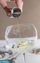 Barman pouring drink to prepare gin tonic cocktail Royalty Free Stock Photo