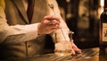 Barman pouring fresh alcoholic drink into the glasses bar counter with background Royalty Free Stock Photo