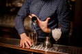 Barman pouring a portion of vodka into the shaker Royalty Free Stock Photo