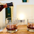 Barman pouring whiskey in glass Royalty Free Stock Photo