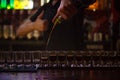 The barman pours a lot of alcoholic shots Royalty Free Stock Photo