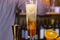 Barman pours mineral water and sparkling wine on Champagne flute prepares alcohol cocktail. Hands close-up. Royalty Free Stock Photo