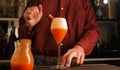 Barman prepares an Italian cocktail called Fragolino with strawberry juice and sparkling wine Royalty Free Stock Photo
