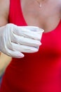 Barmen in post pandemic period serves coffee in disposable medical gloves in white plastic glass. woman in pink shirt