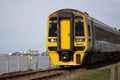 BARMOUTH, GWYNEDD UK - APRIL 09 : Train travelling over the viaduct in Barmouth, Gwynedd on April 09, 2023