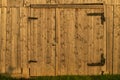 Barn door. Details of a door made of wood with black metal details at a cottage Royalty Free Stock Photo