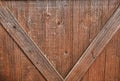 Barn door, weathered wood, cross beams create V pattern Royalty Free Stock Photo