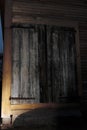 Barn doors on an old barn highlighted at night by a flash