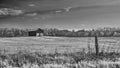 Barn in a Field with Fence Royalty Free Stock Photo