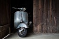 Barn find of old, rusty italian scooter in a hut Royalty Free Stock Photo