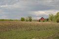 Barn with harvested field