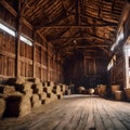a barn with hay stacked on top of the floor and a large window in it