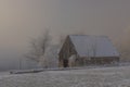 Barn in Krusne mountains in snowy white landscape with frosty trees Royalty Free Stock Photo