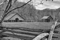 Barn next to a plowed field on the mountain farm Royalty Free Stock Photo