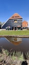 A barn reflected in the canal, from the village of Zaanse Schans, the Netherlands