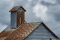 Barn roof top under stormy skies Royalty Free Stock Photo