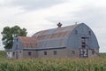 A Barn with a Rusted Roof and Concrete Block Walls Royalty Free Stock Photo