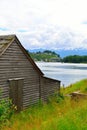 Barn by the shore in Norheimsund, Norway. Royalty Free Stock Photo