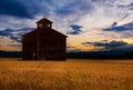 Barn silhouetted at sunset