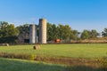 Barn, Silos, and Wagon Royalty Free Stock Photo