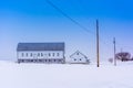 Barn in a snow covered farm field in rural York County, Pennsylvania. Royalty Free Stock Photo