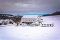 Barn in a snow covered farm field in rural York County, Pennsylvania. Royalty Free Stock Photo