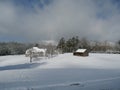 Barn in snow covered field