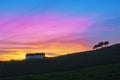 Barn and trees silhouette against sunset sky Royalty Free Stock Photo