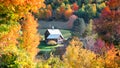 Barn in Vermont country side surrounded by autumn trees