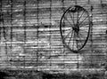 Barn Wall Holds Wire Wagon Wheel Black and White