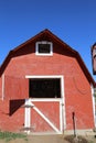 Barn and white barn against the bluest blue sky