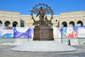 Barnaul, Russia, January, 13, 2016. People walking near the monument to the immigrants to Altai, Barnaul