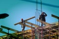 A bricklayer worker erects a wall on the construction of a multi-storey building Royalty Free Stock Photo