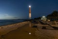 Dark starry night sky over Barnegat Lighthouse on the Jersey shore. Royalty Free Stock Photo