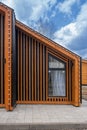 Barnhouse facade element. Bright stylish home. panoramic window. Blue sky