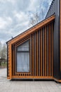 Barnhouse facade element. Bright stylish home. panoramic window. Blue sky