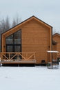 Barnhouse style house. The house is surrounded by snow. Winter and frost. Architectural style