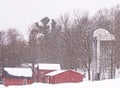 Barns and silos in winter snowstorm Royalty Free Stock Photo