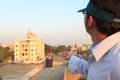 A Indian man was flying a kite during International Kite Festival in Baroda, Gujarat.