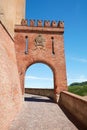 Barolo medieval castle entrance arch and empty street in Italy Royalty Free Stock Photo