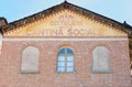 Wine cellar and shop old sign painted on facade in Italy