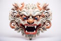 Barong mask on white background. Traditional Balinese dance mask. Craftsmanship and cultural of Bali. Dragon Mask