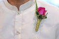 Barong Tagalog with pink corsage at wedding