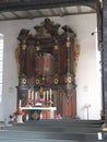 Baroque altar in the two-story interior of a church in Maroldsweisach