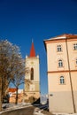 Baroque bell tower called Blatenska vez in winter, Narrow picturesque street, renaissance historical buildings with snow, Blatna