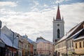 Baroque bell tower called Blatenska vez in winter, Narrow picturesque street, renaissance historical buildings with snow, Blatna